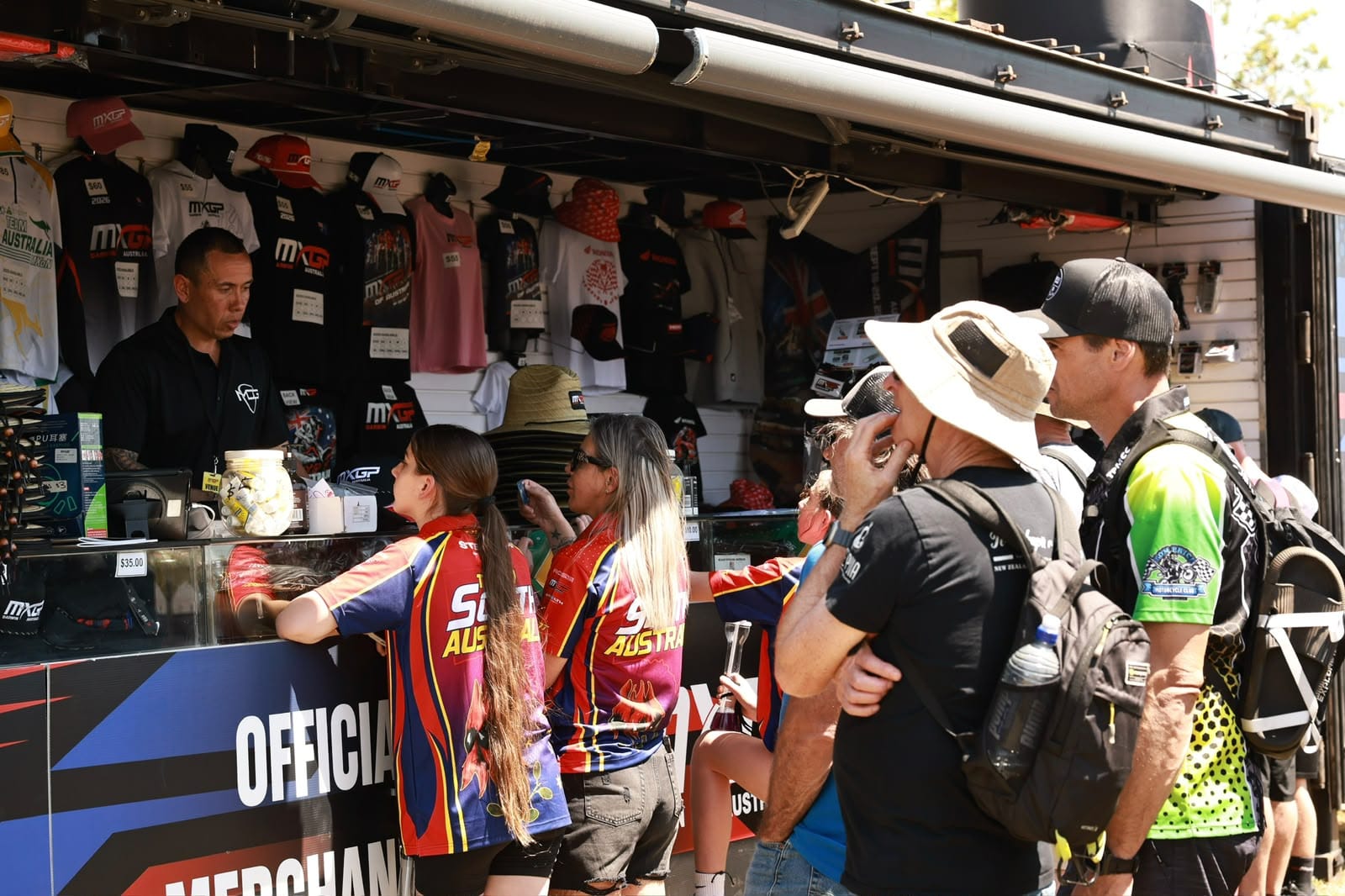 Spectators purchasing official MXGP of Australia merchandise from the event merchandise outlet at Hidden Valley.